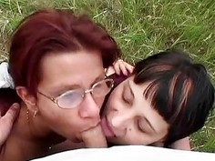 Dirty slave sucking two cocks outdoor